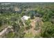 Single story home nestled in a wooded area at 1136 Davis Ln, Englewood, FL 34224