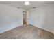 Well-lit bedroom with tile floors and access to another room at 1136 Davis Ln, Englewood, FL 34224