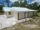 Newly remodeled single story home with metal roof and stone accents at 1136 Davis Ln, Englewood, FL 34224
