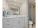 Stylish bathroom with white vanity and shower at 1345 Mediterranean Dr # A204, Punta Gorda, FL 33950