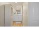 Clean bathroom with white vanity and linen cabinet at 1345 Mediterranean Dr # A204, Punta Gorda, FL 33950