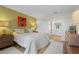 Spacious bedroom with king-size bed and ensuite bathroom access at 1345 Mediterranean Dr # A204, Punta Gorda, FL 33950