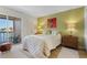 Comfortable bedroom with a queen-size bed and water views at 1345 Mediterranean Dr # A204, Punta Gorda, FL 33950