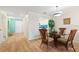 Charming dining area with glass table and four chairs at 1345 Mediterranean Dr # A204, Punta Gorda, FL 33950