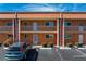 Condo building exterior showcasing a balcony and parking at 1345 Mediterranean Dr # A204, Punta Gorda, FL 33950