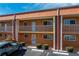 Condo building exterior with parking and unit entrance highlighted at 1345 Mediterranean Dr # A204, Punta Gorda, FL 33950