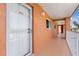 Condo hallway with light-colored walls and white door at 1345 Mediterranean Dr # A204, Punta Gorda, FL 33950