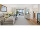 Bright living room with water views and comfy seating at 1345 Mediterranean Dr # A204, Punta Gorda, FL 33950
