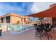 Community pool with lounge chairs and patio seating at 1345 Mediterranean Dr # A204, Punta Gorda, FL 33950