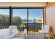 Enjoy water views from this screened balcony, furnished with seating at 1345 Mediterranean Dr # A204, Punta Gorda, FL 33950