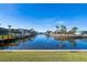 Scenic waterfront view with boats and lush landscaping at 1345 Mediterranean Dr # A204, Punta Gorda, FL 33950