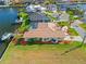 Aerial view of a home with a boat dock and beautiful landscaping at 1346 Osprey Dr, Punta Gorda, FL 33950