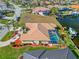 Aerial view of waterfront house featuring a screened-in pool and private dock at 1346 Osprey Dr, Punta Gorda, FL 33950