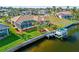 A screened-in pool, boat dock, and waterfront views create an ideal backyard for relaxation and recreation at 1346 Osprey Dr, Punta Gorda, FL 33950