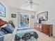 Bedroom with wood floors and pool view at 1346 Osprey Dr, Punta Gorda, FL 33950