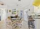 Cozy dining area with seating for four and bar seating at the kitchen island at 1346 Osprey Dr, Punta Gorda, FL 33950