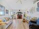 Inviting living room with wood floors, fireplace and large windows at 1346 Osprey Dr, Punta Gorda, FL 33950