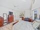 Main bedroom with furniture and access to the outdoor patio with water view at 1346 Osprey Dr, Punta Gorda, FL 33950