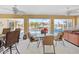 Screened patio with tile flooring, outdoor seating, and a view of the pool and canal at 1346 Osprey Dr, Punta Gorda, FL 33950