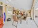 Enclosed patio featuring tile flooring, outdoor seating, and sliding glass doors at 1346 Osprey Dr, Punta Gorda, FL 33950