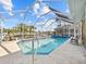 Enclosed pool with spa and outdoor seating overlooking the canal at 1346 Osprey Dr, Punta Gorda, FL 33950