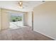 Main bedroom with sliding glass doors opening to the patio at 1426 Natrona Dr, North Port, FL 34286