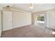 Large bedroom with sliding glass doors opening to a patio at 1426 Natrona Dr, North Port, FL 34286