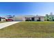 Single-story home with a large front yard and attached garage at 1426 Natrona Dr, North Port, FL 34286