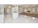 Open kitchen with island and views into the living room at 1426 Natrona Dr, North Port, FL 34286