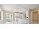 White kitchen with breakfast bar and access to the patio at 1426 Natrona Dr, North Port, FL 34286