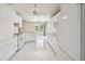 Kitchen features white appliances and an island at 1426 Natrona Dr, North Port, FL 34286