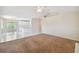 Bright living room with vaulted ceiling and access to kitchen at 1426 Natrona Dr, North Port, FL 34286