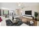 Open living space with a view into the kitchen and dining area at 1426 Natrona Dr, North Port, FL 34286