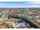 Aerial view showing waterfront home, neighborhood context, and surrounding canals at 1454 Kiwi Ct, Punta Gorda, FL 33950