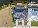 Property showcasing dark metal roof, pool, and location in a residential neighborhood at 1454 Kiwi Ct, Punta Gorda, FL 33950