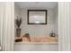 Relaxing bathroom featuring a built-in soaking tub and a calming atmosphere at 1454 Kiwi Ct, Punta Gorda, FL 33950