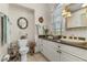 Clean bathroom with white vanity and a window at 1454 Kiwi Ct, Punta Gorda, FL 33950