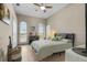 Charming bedroom with a queen-size bed and large windows at 1454 Kiwi Ct, Punta Gorda, FL 33950