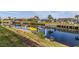Scenic view of the canal with private dock and lush landscaping at 1454 Kiwi Ct, Punta Gorda, FL 33950