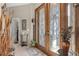 Bright entryway with double doors, tile flooring, and decorative accents at 1454 Kiwi Ct, Punta Gorda, FL 33950
