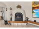 Charming corner fireplace with unique stucco design at 1454 Kiwi Ct, Punta Gorda, FL 33950
