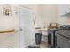 Convenient laundry room with washer, dryer, and utility sink at 1454 Kiwi Ct, Punta Gorda, FL 33950
