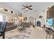Spacious living room featuring a cozy fireplace and large TV at 1454 Kiwi Ct, Punta Gorda, FL 33950