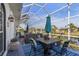 Relaxing screened-in patio with seating area and outdoor dining at 1454 Kiwi Ct, Punta Gorda, FL 33950