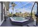 Inviting screened-in pool area, perfect for relaxation and entertaining at 1454 Kiwi Ct, Punta Gorda, FL 33950
