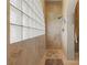 Spacious shower with glass block window and neutral tile at 1454 Kiwi Ct, Punta Gorda, FL 33950