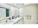 Clean bathroom with double vanity and marble countertop at 1640 Atares Dr # 31, Punta Gorda, FL 33950
