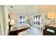 Well-lit bedroom with a queen bed and lots of natural light at 1640 Atares Dr # 31, Punta Gorda, FL 33950