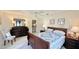 Comfortable bedroom with a queen-size bed and dark wooden furniture at 1640 Atares Dr # 31, Punta Gorda, FL 33950