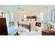Bright bedroom featuring a king-size bed and ample closet space at 1640 Atares Dr # 31, Punta Gorda, FL 33950